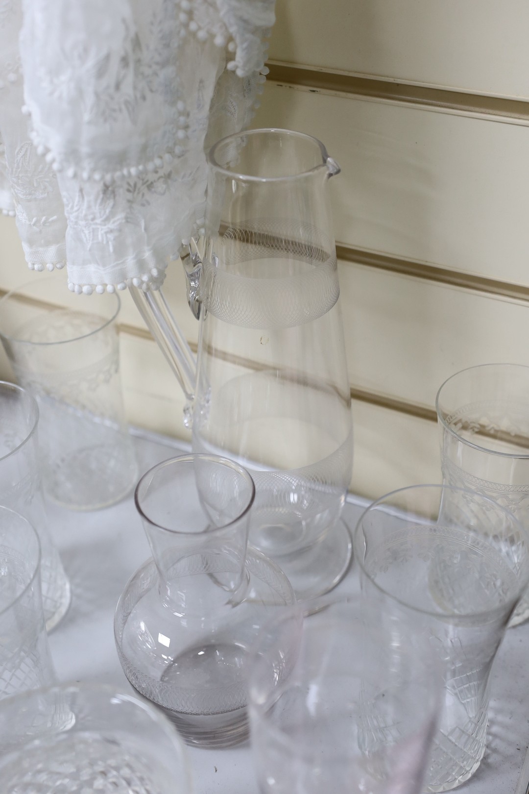 A set of four Victorian glass pedestal bowls and etched glassware, Jug 28 cms high (14)